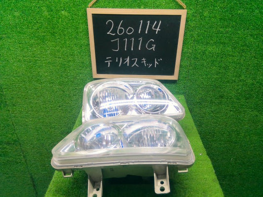 【中古】テリオスキッド ABA-J111G ヘッドランプ左右セット 81110-B4140