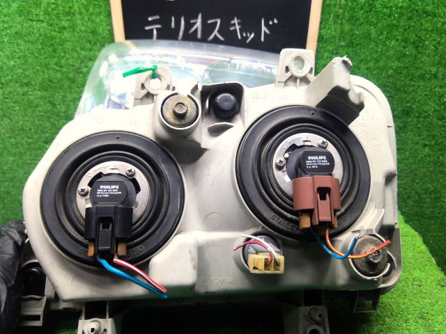 【中古】テリオスキッド ABA-J111G ヘッドランプ左右セット 81110-B4140
