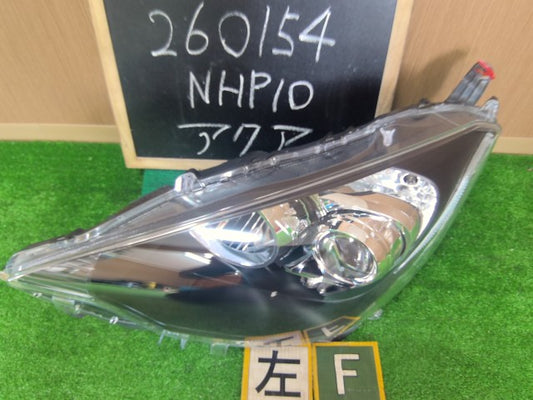 【中古】アクア DAA-NHP10 左ヘッドランプ 左ヘッドライト