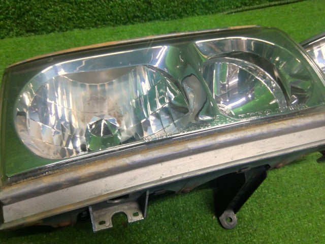 【中古】ランドクルーザー S-HDJ81V ヘッドランプ左右セット 81110-60371